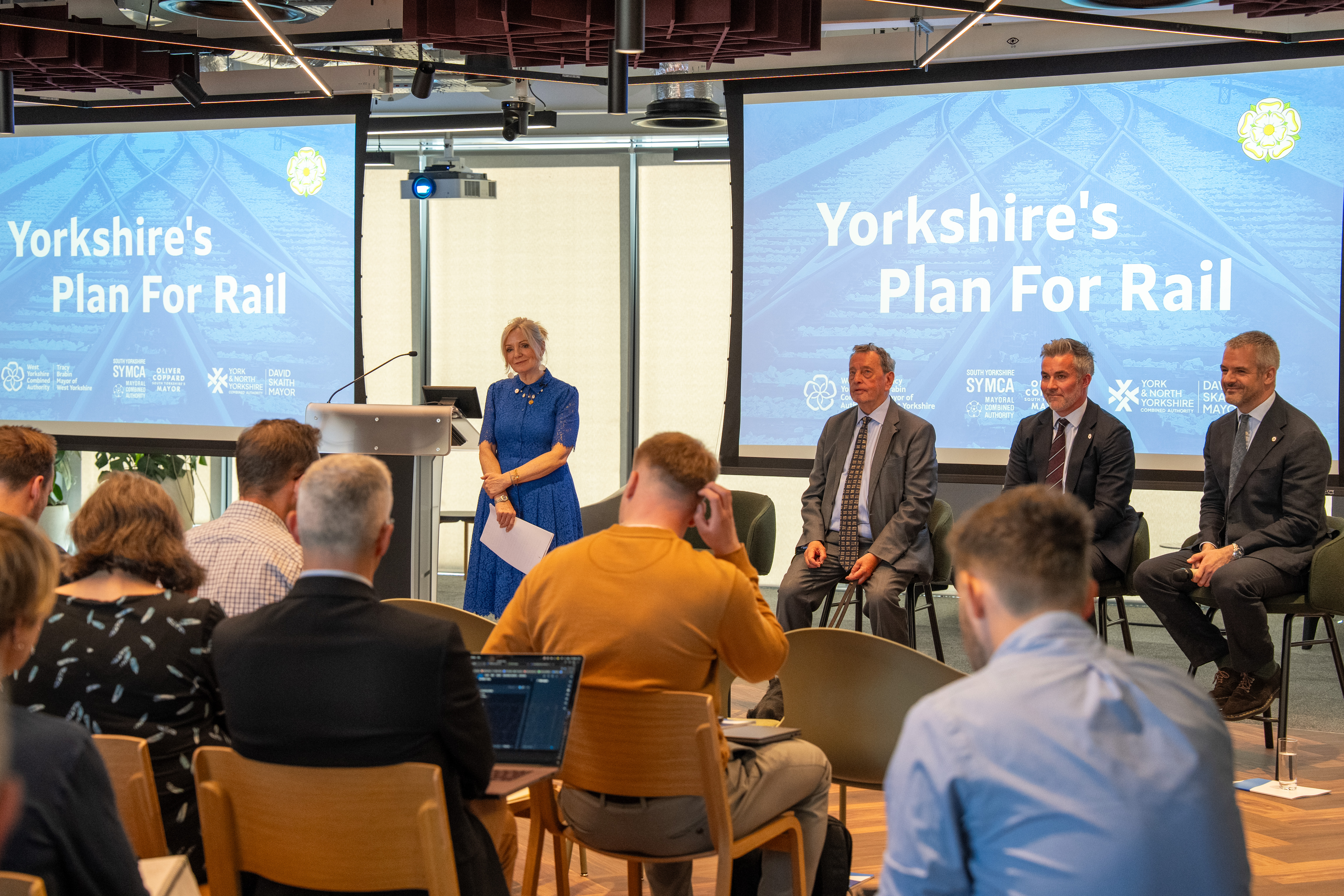 Three mayors and Lord Blunkett in front of an audience